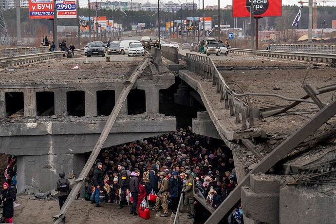 Ukrainian_civilians_and_soldiers_take_shelter_under_a_bridge_in_Kyiv